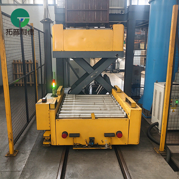 Rail Guided Vehicle with Roller Table for Automated Bin Transfer
